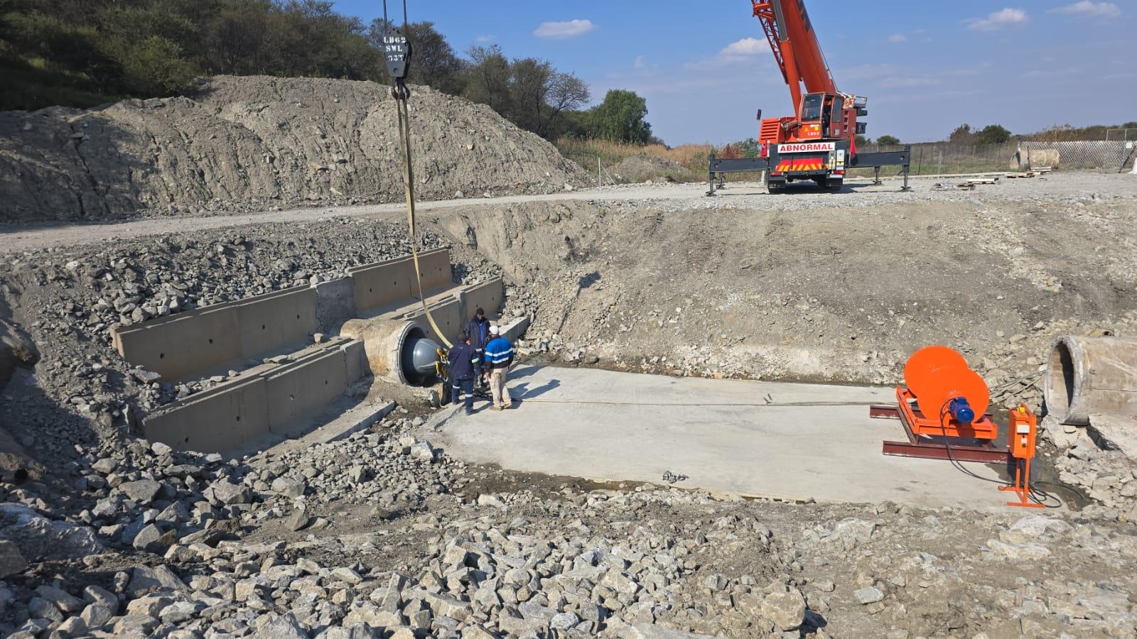 Winches SA winch positioned at a test site pulling a pipeline relining pig through concrete pipe sections at Impala Platinum's slimes dam