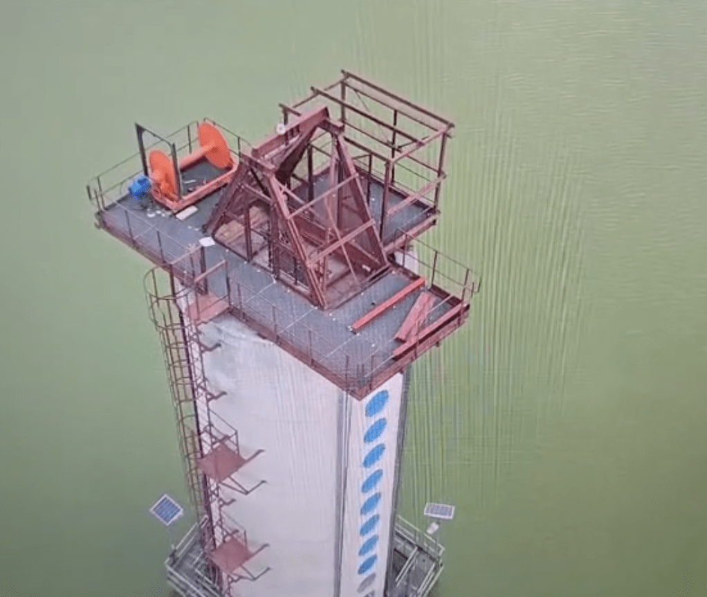 Aerial view of two Winches SA cable winches permanently mounted on the platform atop a pipe-relining tower at Impala Platinum's slimes dam