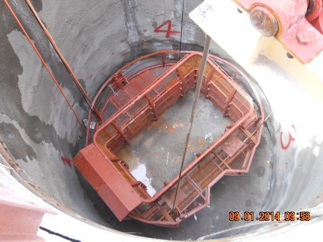 Winches SA custom crab winch lowering a work platform inside a concrete chimney flue shaft at Kusile Power Station, built for Shaft Sinkers