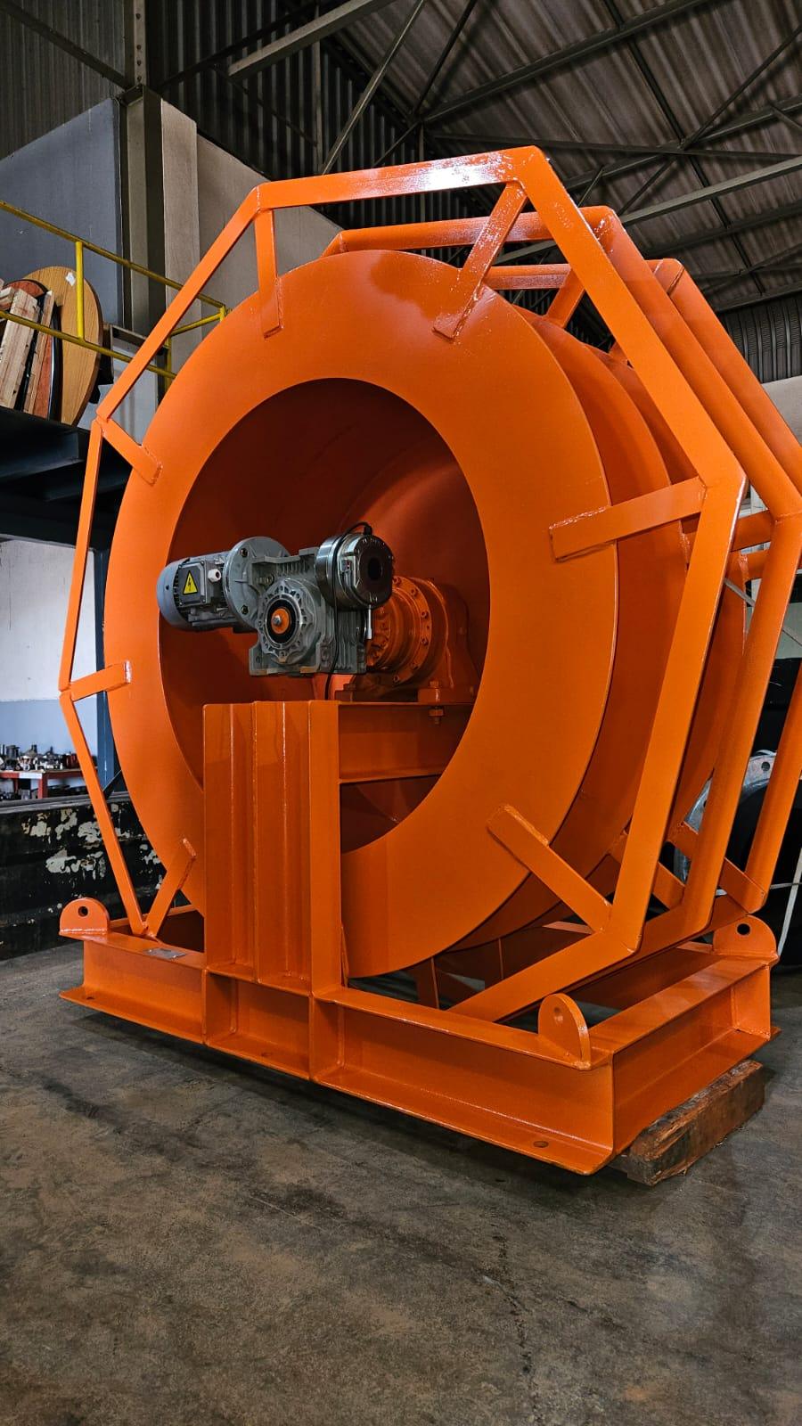 Winches SA heavy-duty electric cable reeler with wide-flange welded steel drum, worm-gearbox drive and electric motor in a structural-steel skid frame, custom-built in Silverton, Pretoria for underground dewatering cable management at Pan African Resources MTR